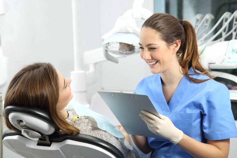 person smiling while talking to orthodontist